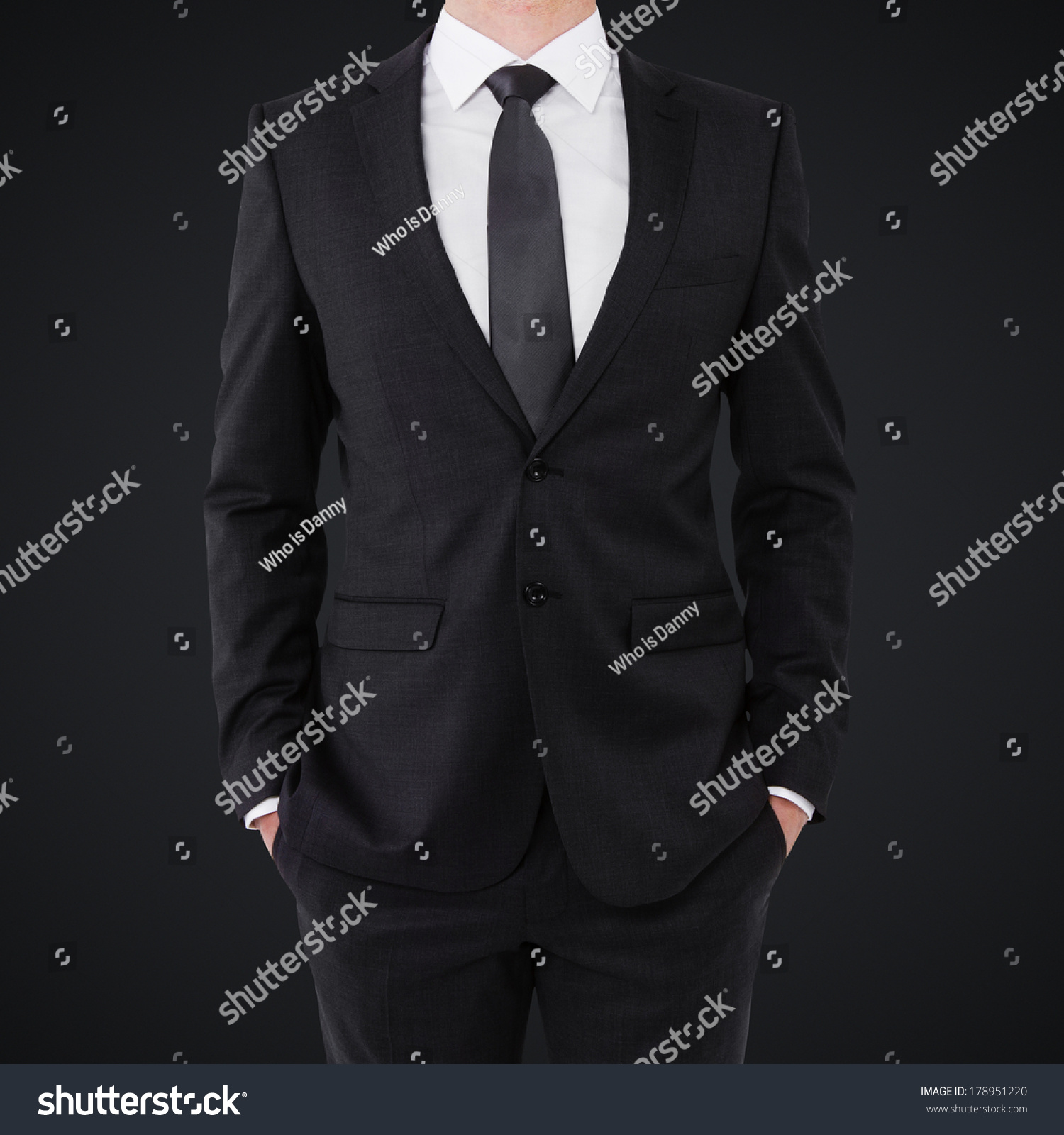 Young Businessman In A Suit Holds Hands In Pockets Stock Photo ...