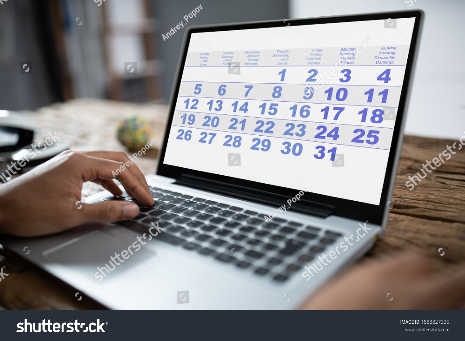 Young Businessman Looking Calendar On Laptop Stock Photo 1588827325 ...