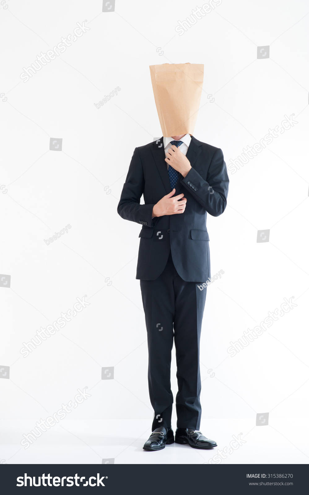 Young Businessman Wearing Carton Stock Photo Edit Now 315386270 Young Businessman Wearing Carton Stock Photo Edit Now 315386270