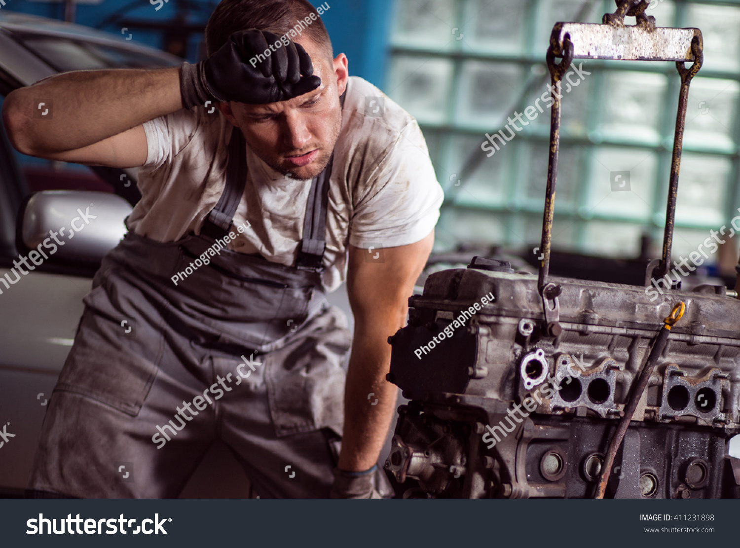 Young Car Mechanic Is Very Tired At His Work Stock Photo 411231898 ...