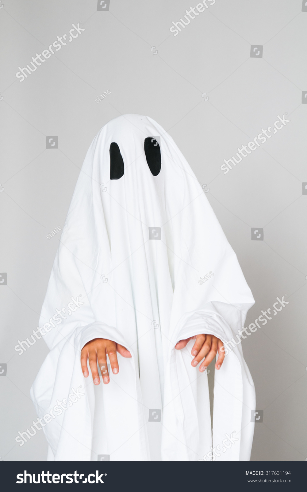 Young Child Dressed In A Ghost Costume For Halloween Stock Photo ...