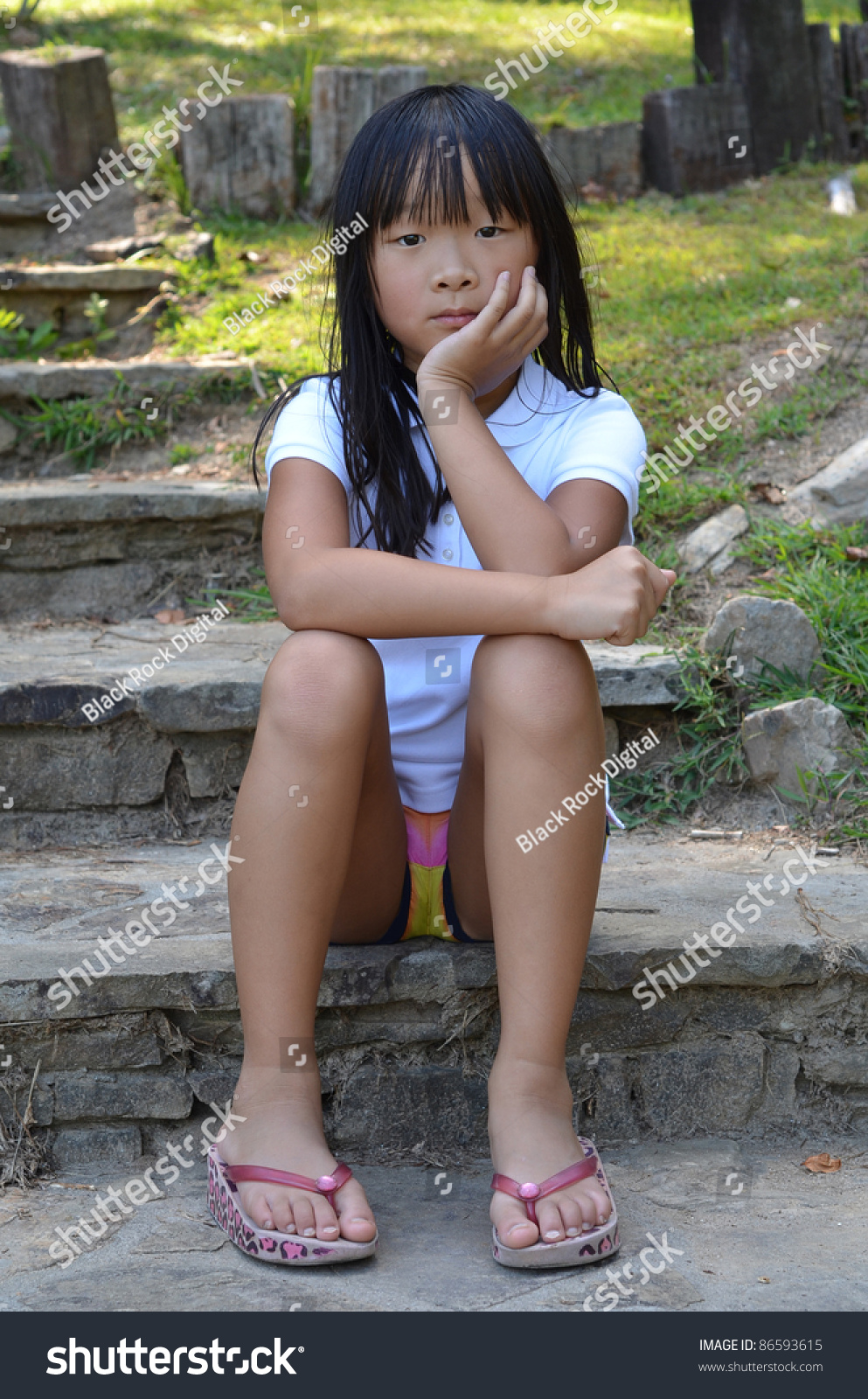 Young Chinese Girl Sitting On Stone Stock Photo 86593615 - Shutterstock