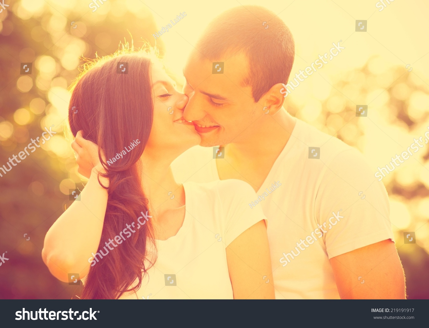 Young Couple Kissing In The Park. Stock Photo 219191917 : Shutterstock