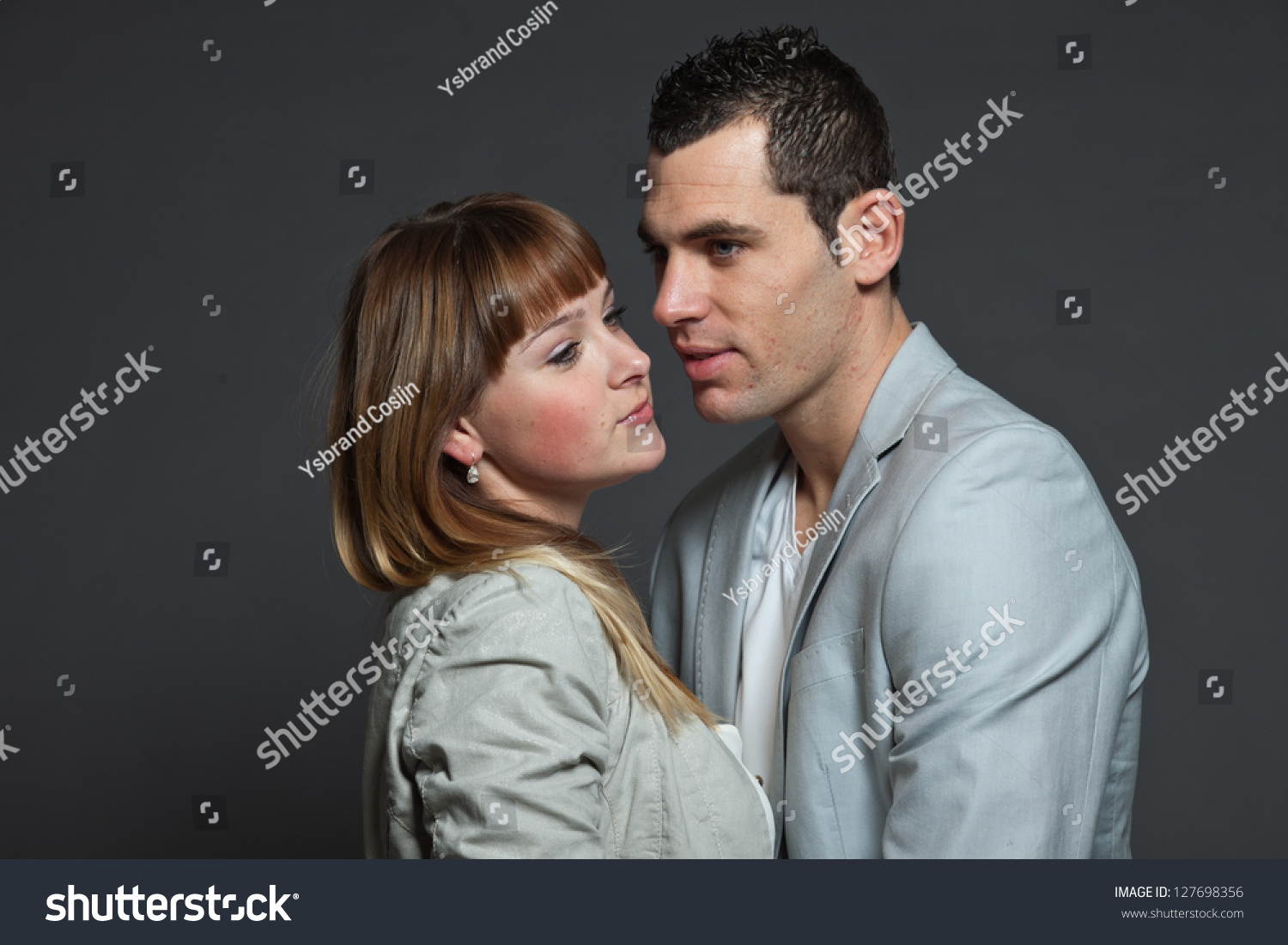 https://image.shutterstock.com/z/stock-photo-young-couple-man-and-woman-in-love-studio-shot-127698356.jpg