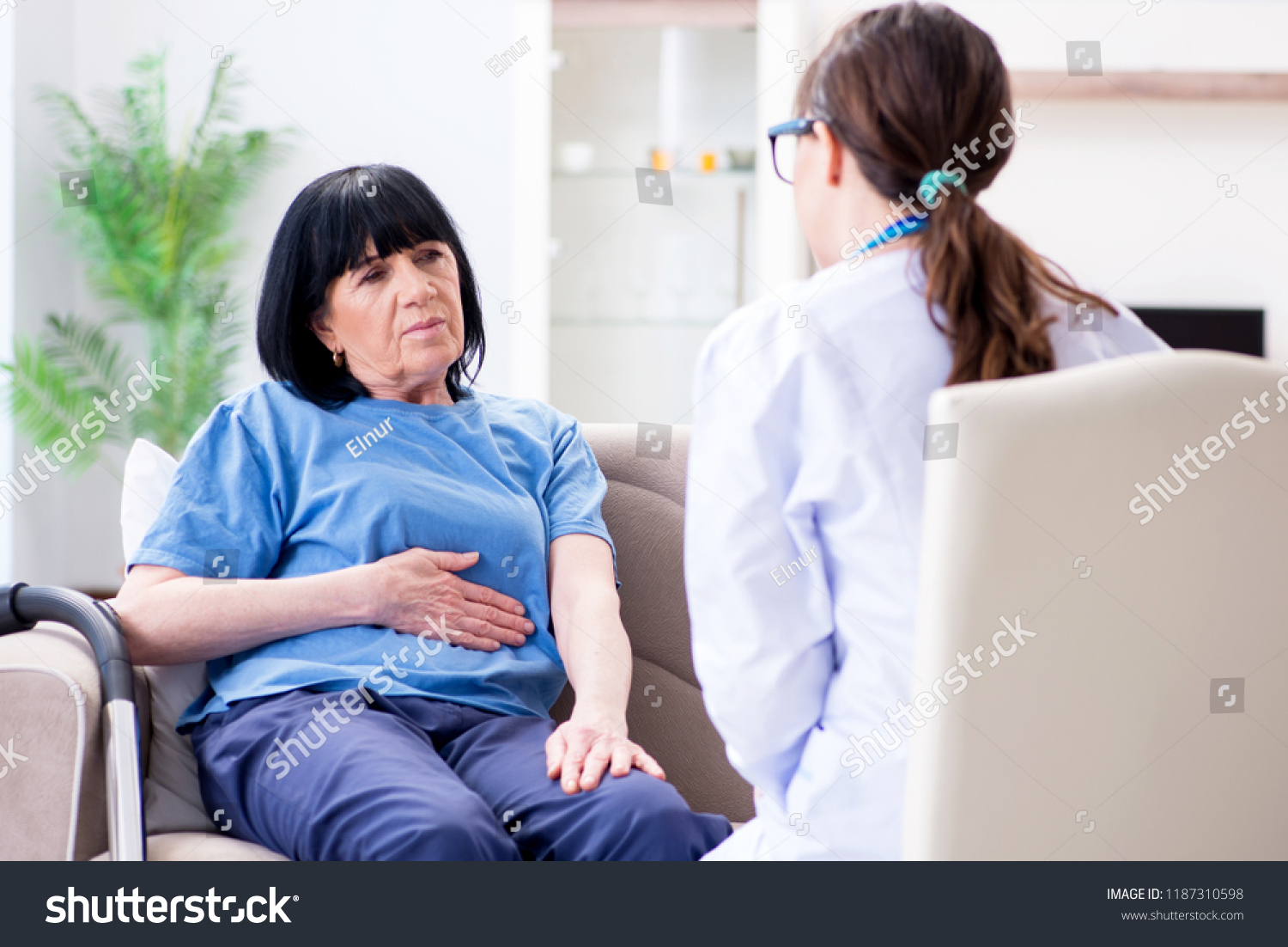 Young Doctor Visiting Old Mature Woman Stock Photo Edit Now