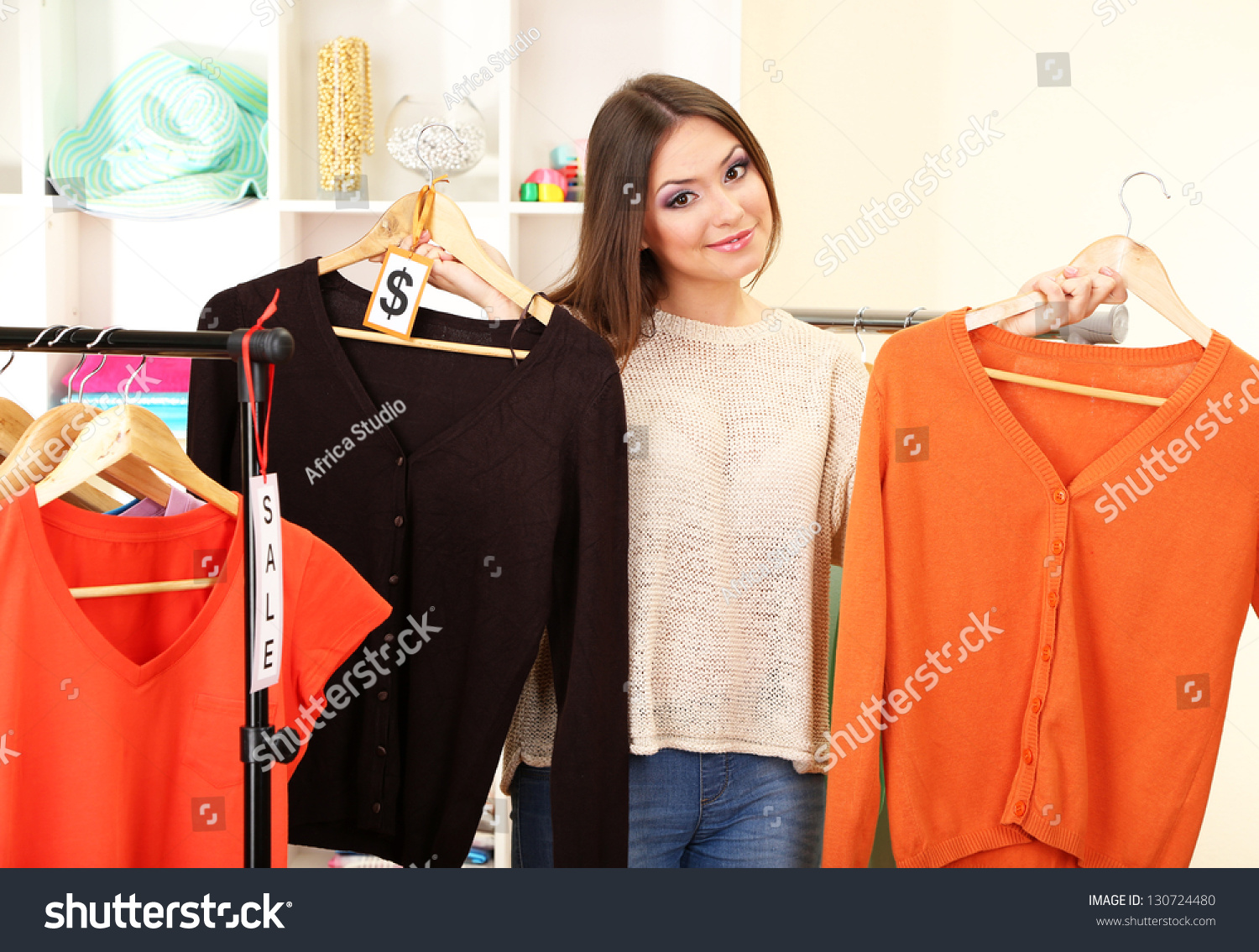Young Girl In Shop Buying Clothes Stock Photo 130724480 : Shutterstock