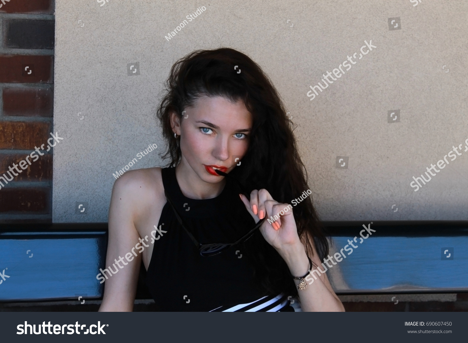 Young Glamorous Seductive Brunette Woman Blue Stock Photo