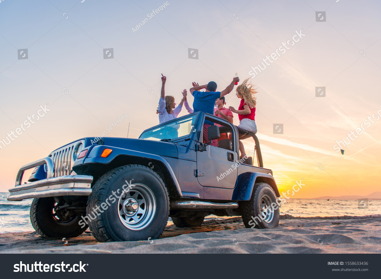 Young Group Having Fun On Beach Stock Photo 1558633436 | Shutterstock