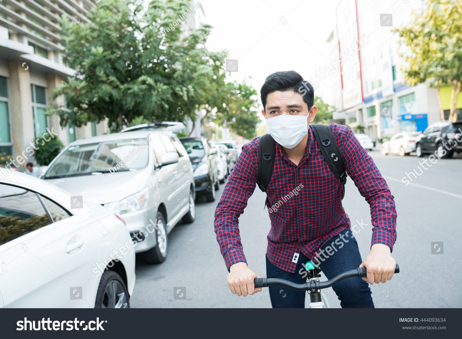 Download Young Guy Face Mask Riding Bike Nature Stock Image 444093634 PSD Mockup Templates