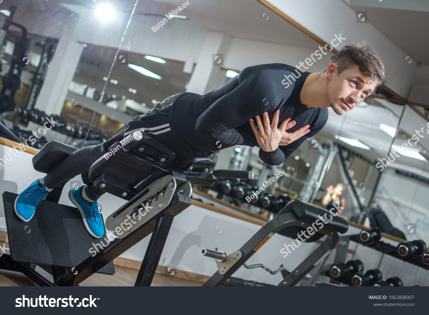 Young Handsome Fit Man Performing Backextension Stock Photo 1062808007