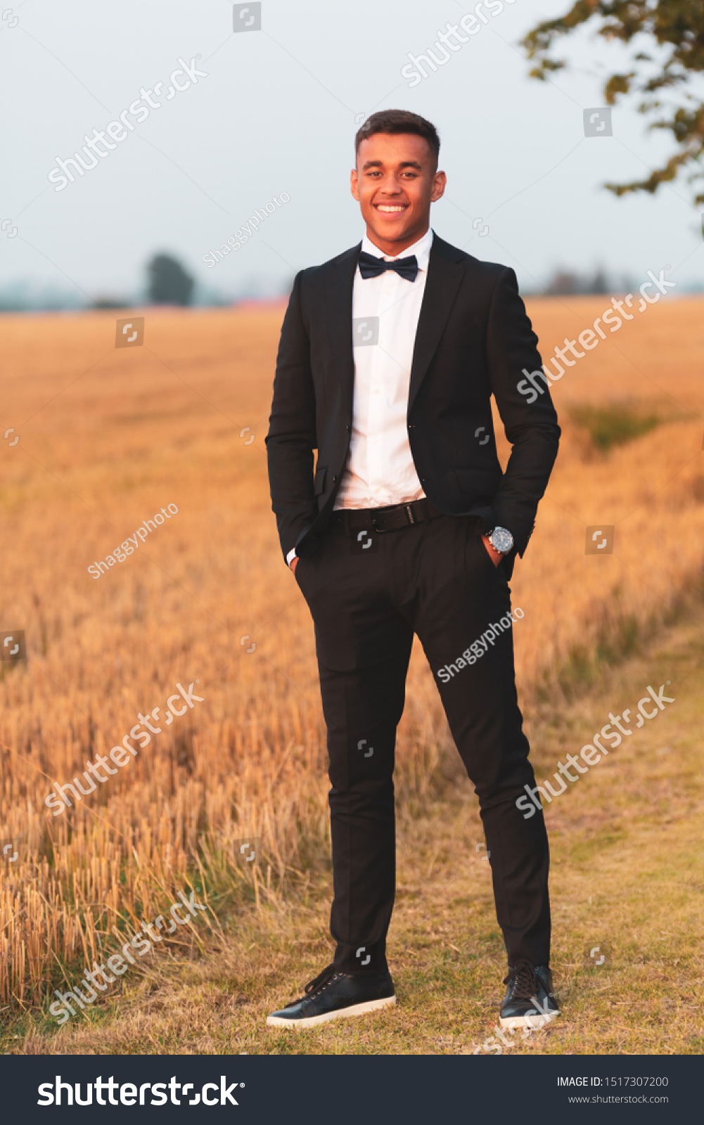 black suit orange bow tie