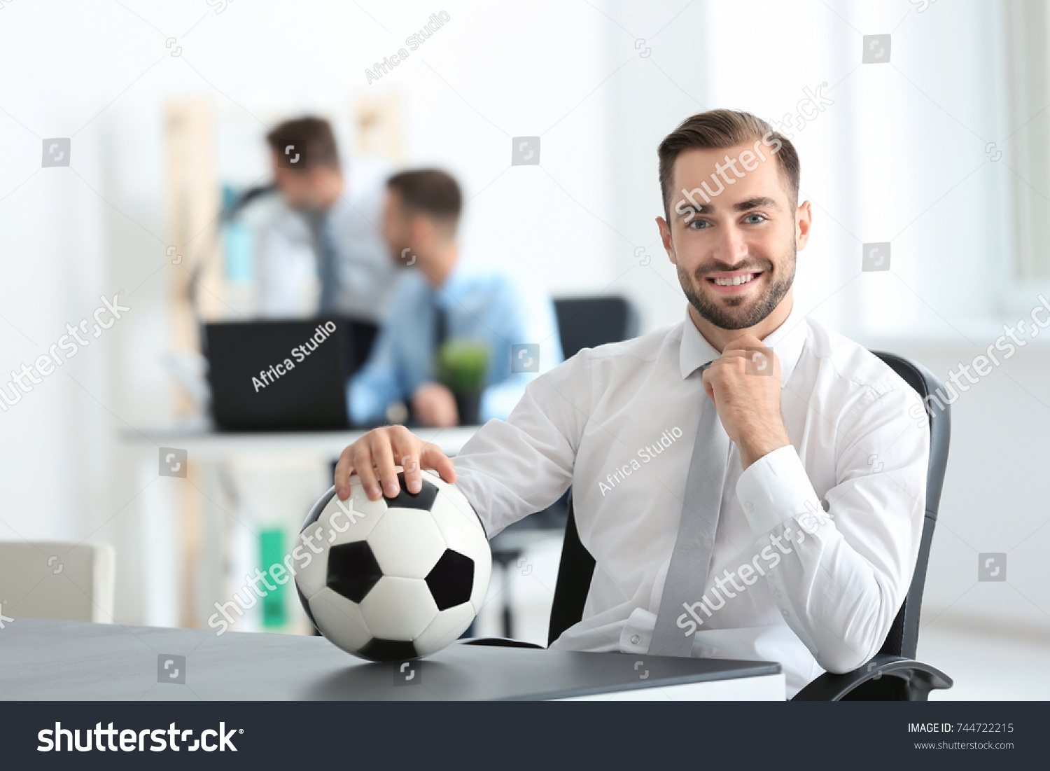 young handsome man soccer ball office stock photo royalty free 744722215 shutterstock