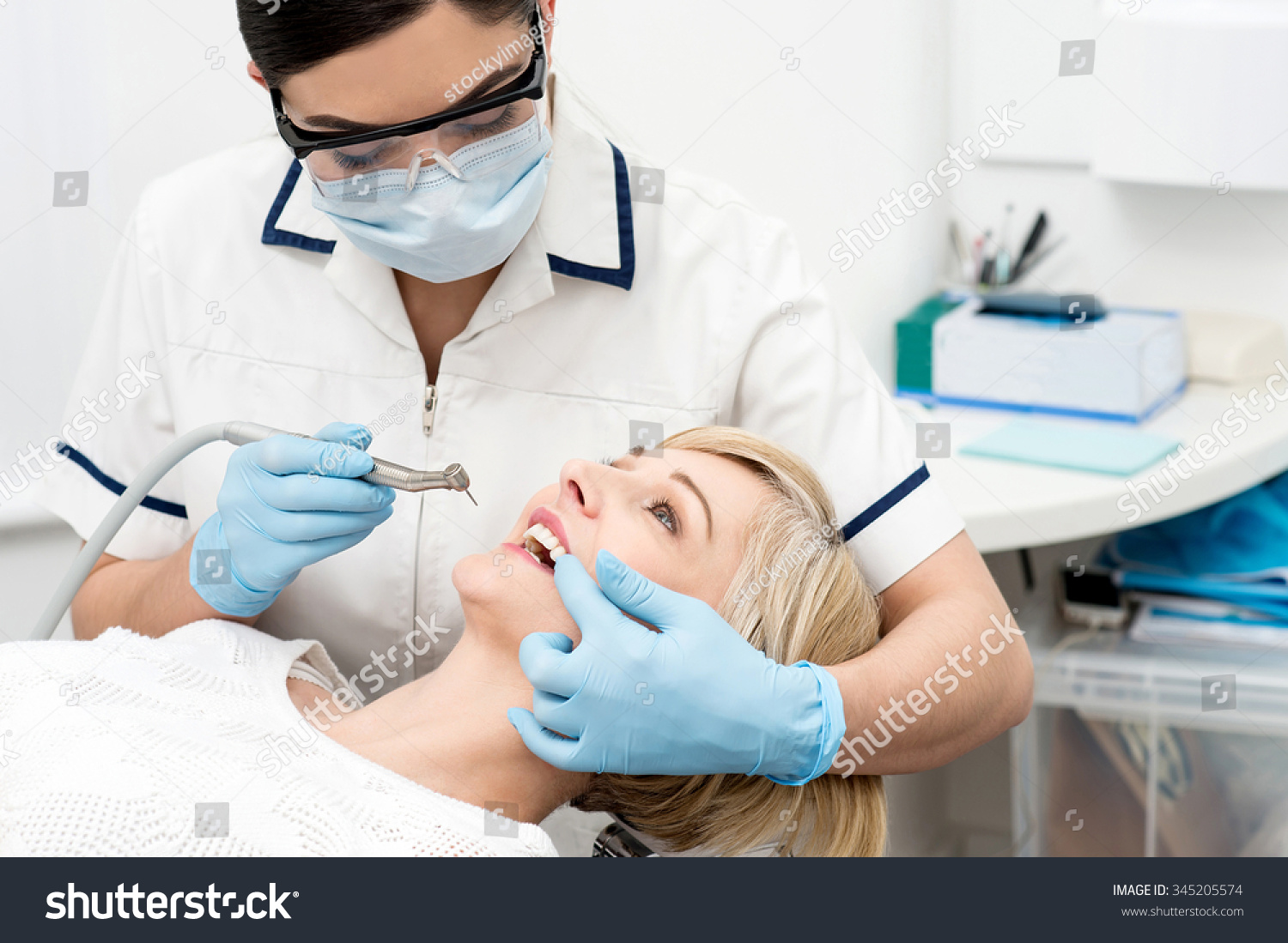 Young Lady Dentist Cleaning Patients Teeth Stock Photo 345205574 ...