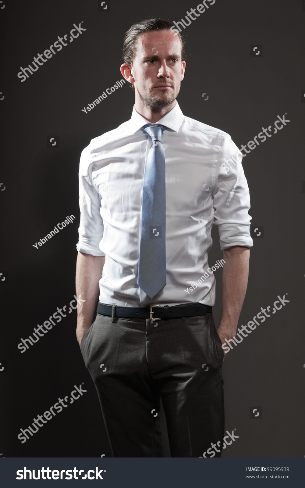 grey pants white shirt blue tie