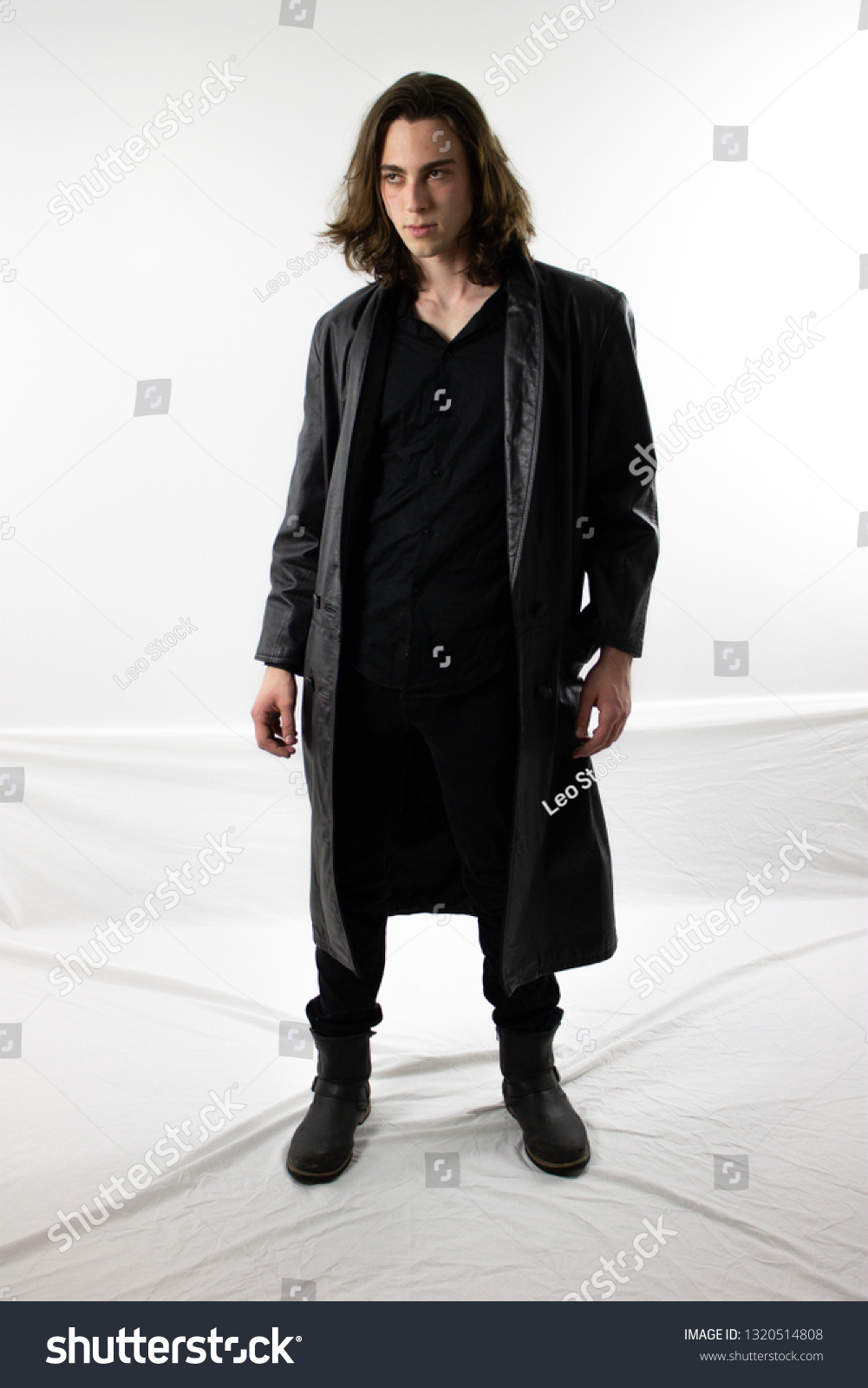 man in black trench coat