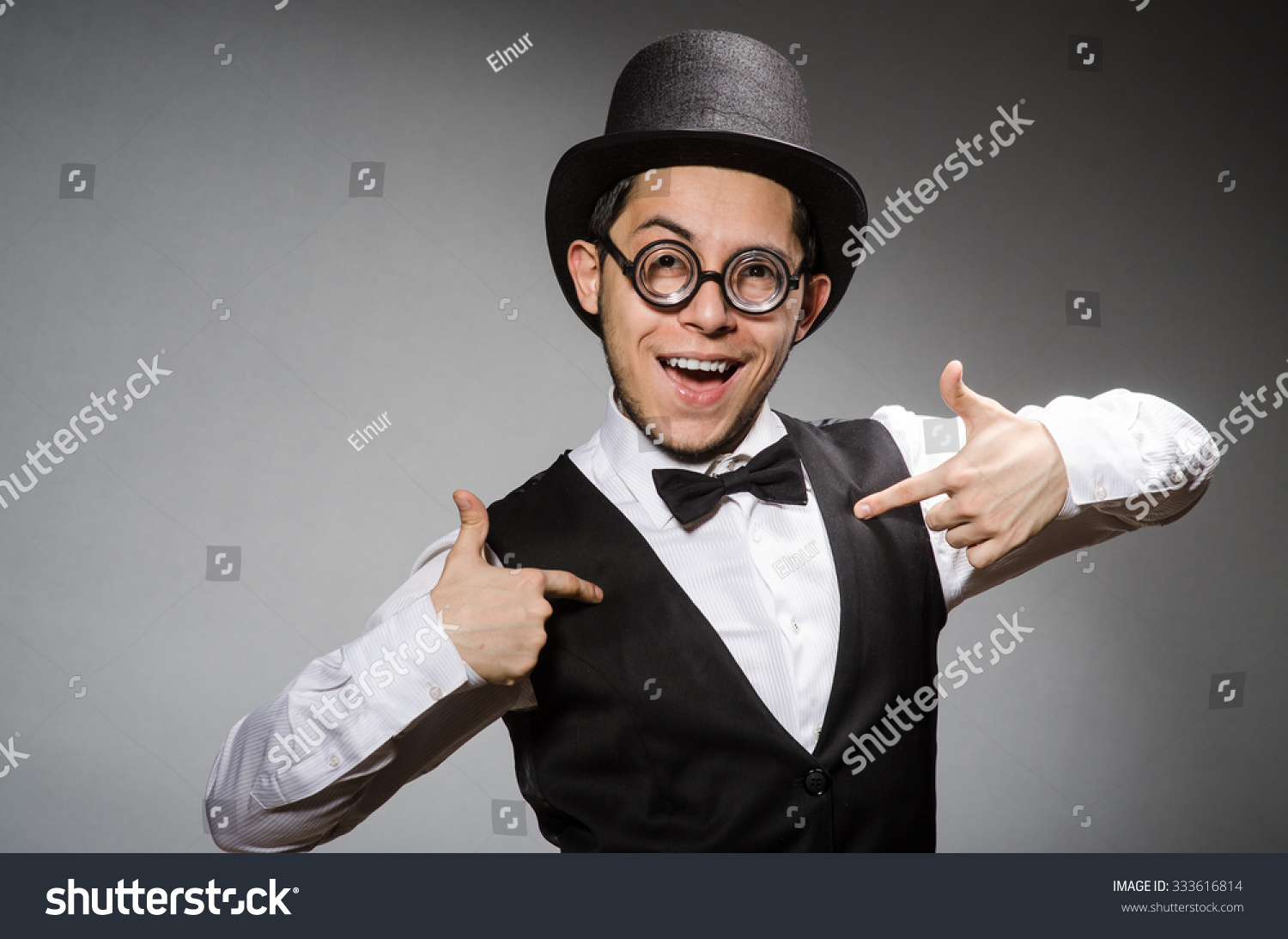 Young Man In Classical Black Vest And Hat Against Gray Stock Photo ...