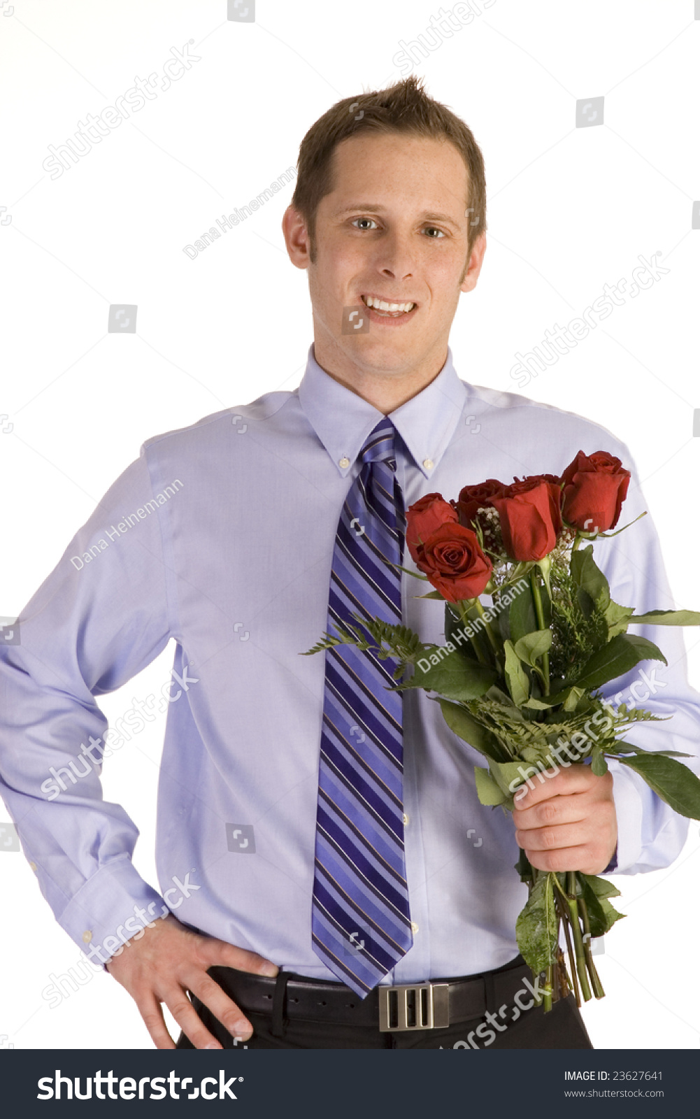 Young Man In Suit Holding Roses On White Background. Stock Photo ...