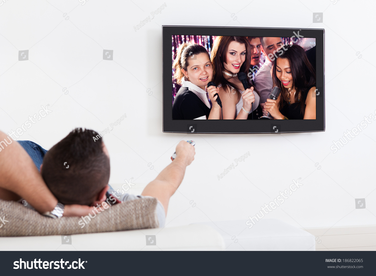 Young Man Listening Karaoke On Tv Stock Photo 186822065 Shutterstock