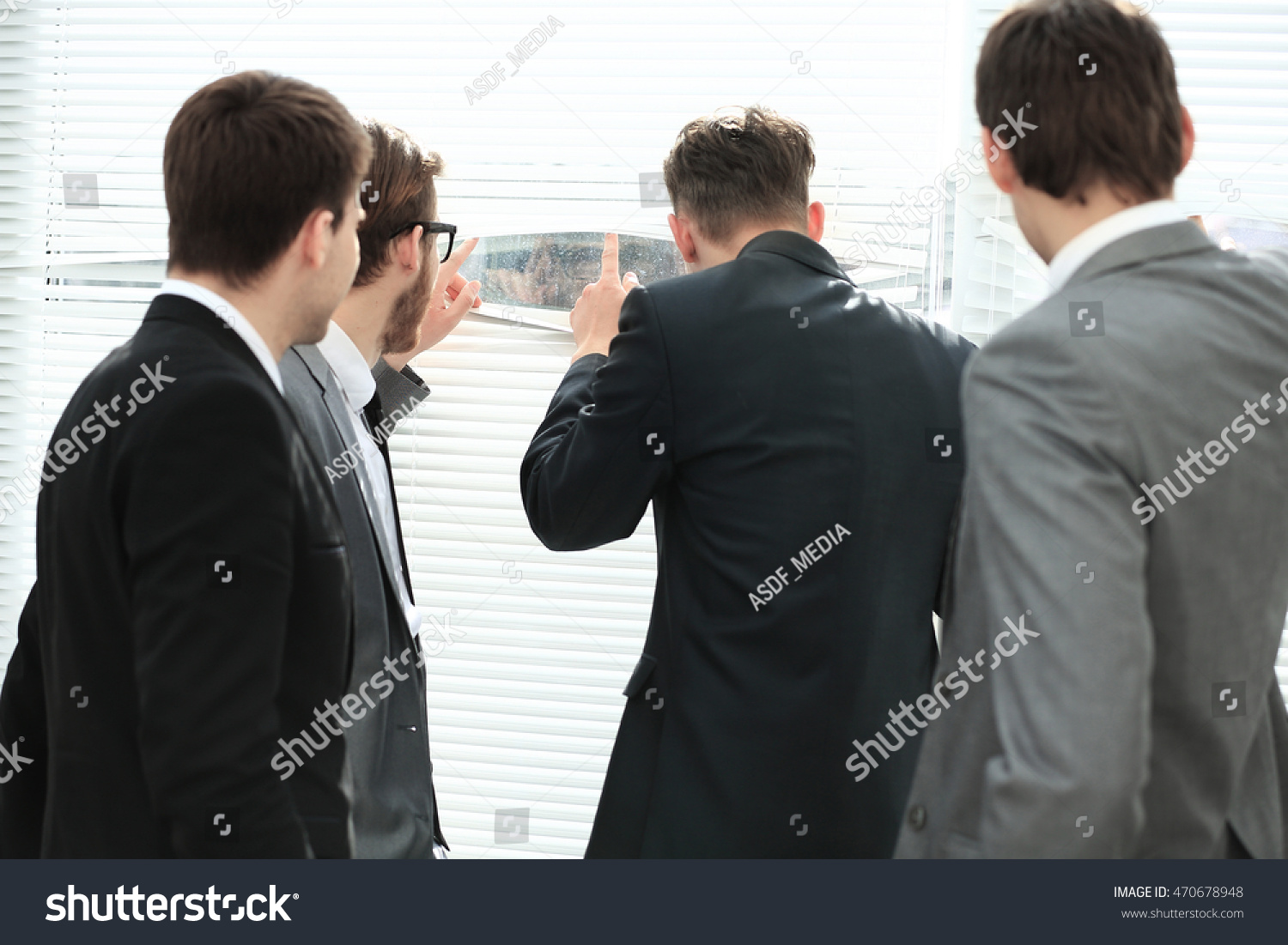 Young Man Looking Through Blinds Window Stock Photo Edit Now