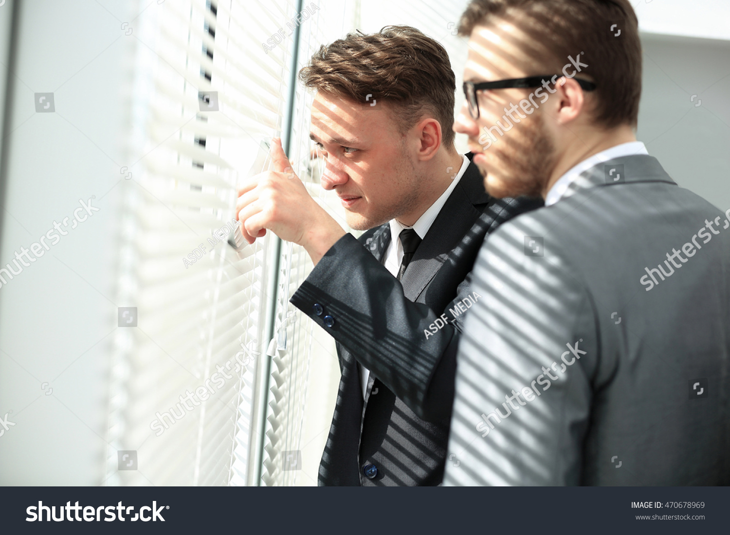 Young Man Looking Through Blinds Window Stock Photo Edit Now