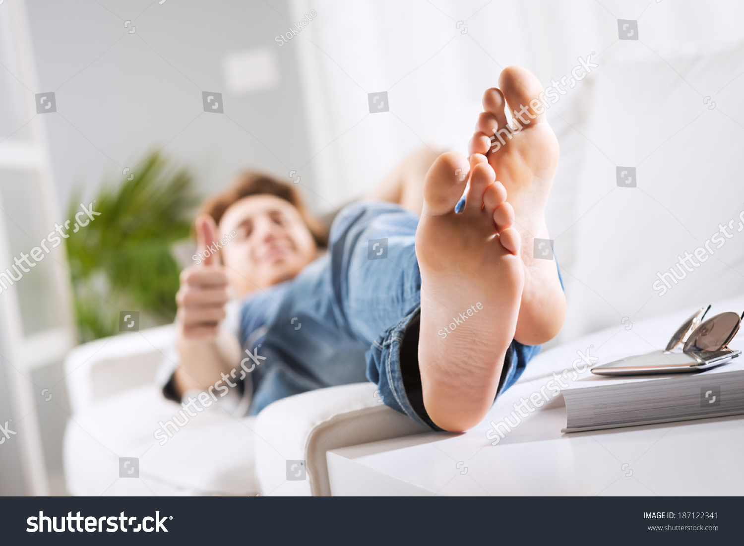 Young Man Relaxing On Sofa Living Stock Photo 187122341 