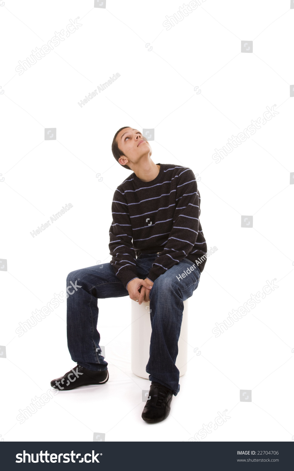 Young Man Seated In A Bench Looking Up To The Copy Space Stock Photo ...