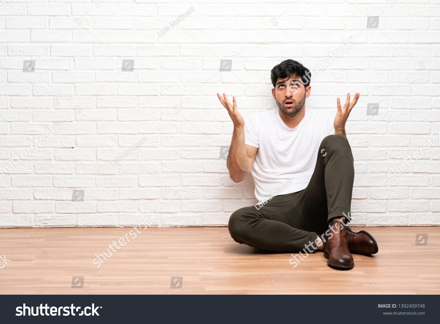 Young Man Sitting On Floor Frustrated Stock Photo 1392409748 | Shutterstock