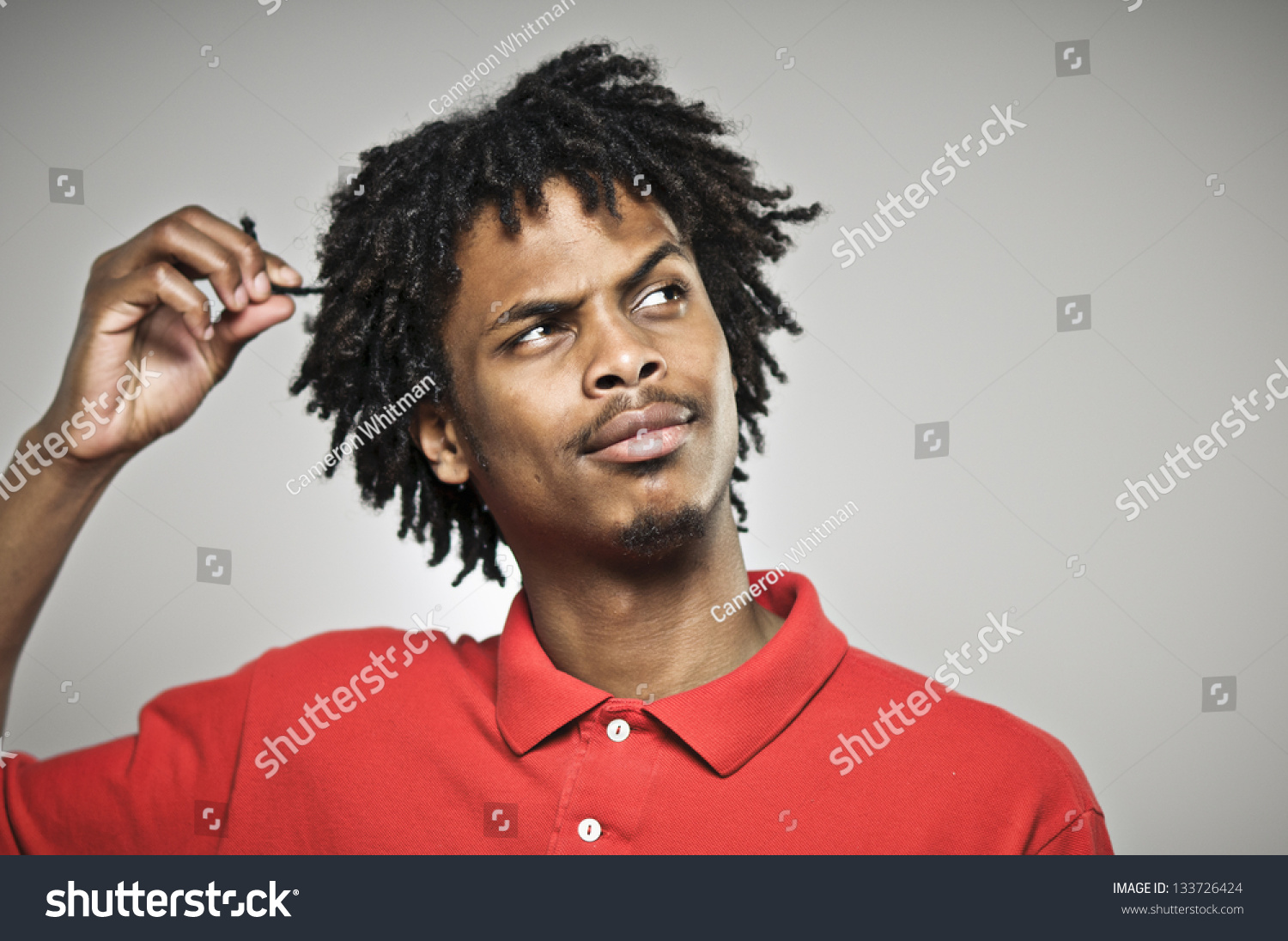 Young Man Twists His Hair While Stock Photo Edit Now 133726424