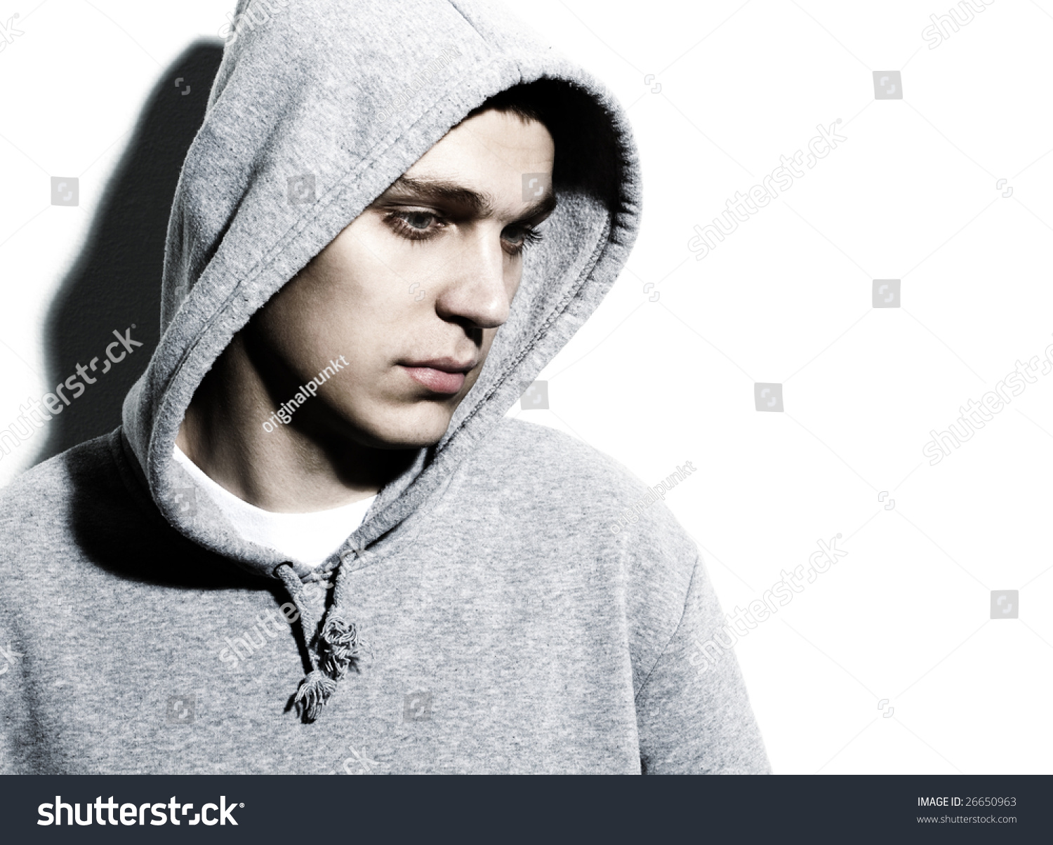 Young Man Wearing Hooded Sweatshirt Stock Photo 26650963 : Shutterstock