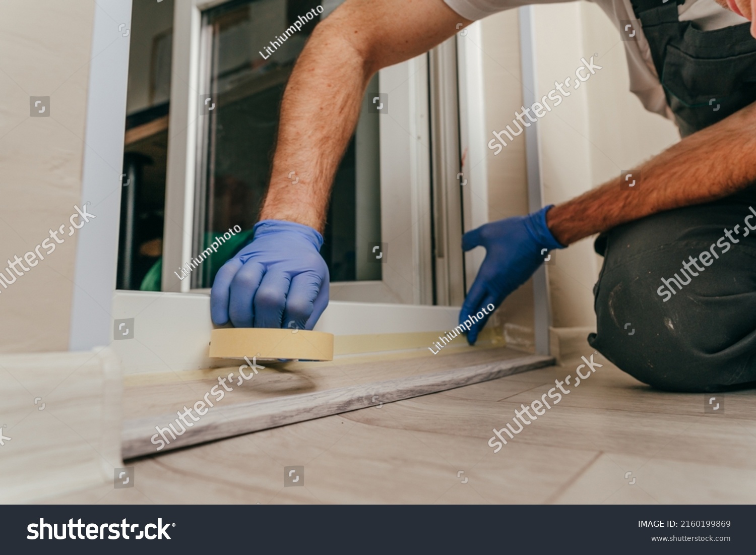 939 Silicone Tape Images Stock Photos Vectors Shutterstock   Stock Photo Young Man Wearing Overalls Applying Mounting Tape Before Sealing A Door Using Waterproof Silicone 2160199869 