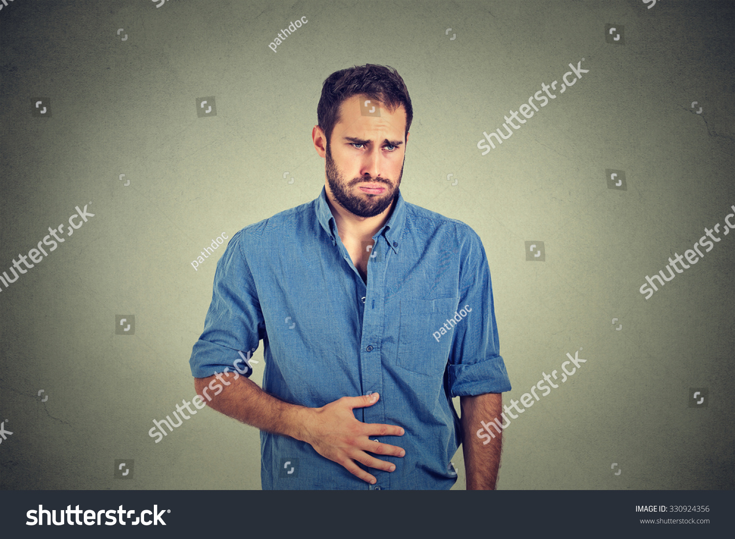 Young Man With Stomach Pain Indigestion Stock Photo 330924356 ...