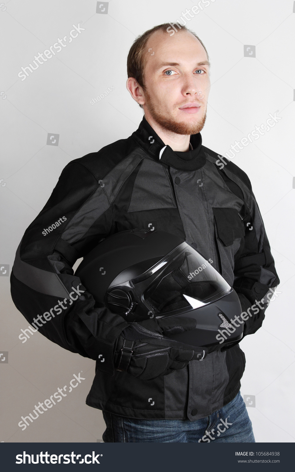 Young Motorcyclist Man Holding Helmet In Studio Stock Photo 105684938 ...