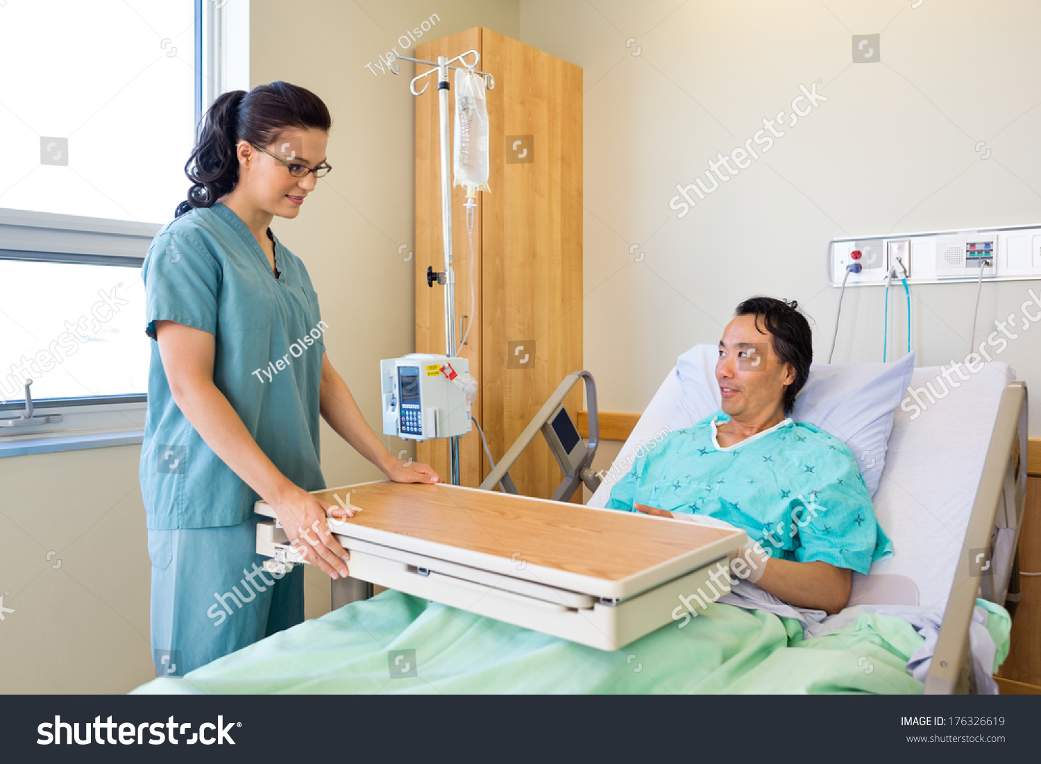 Young Nurse Placing Overbed Table Male Stock Photo 176326619 - Shutterstock