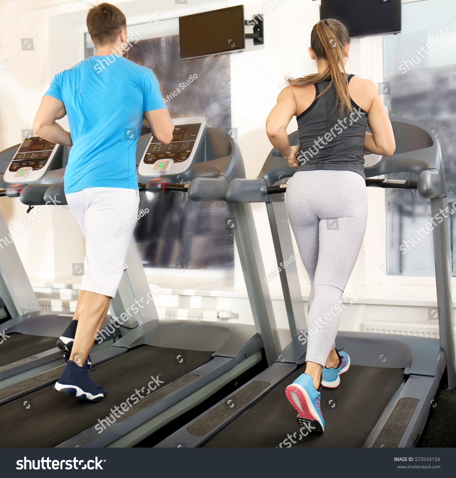 Young People Running On Treadmills Gym Stock Photo (Edit Now) 573543154 ...