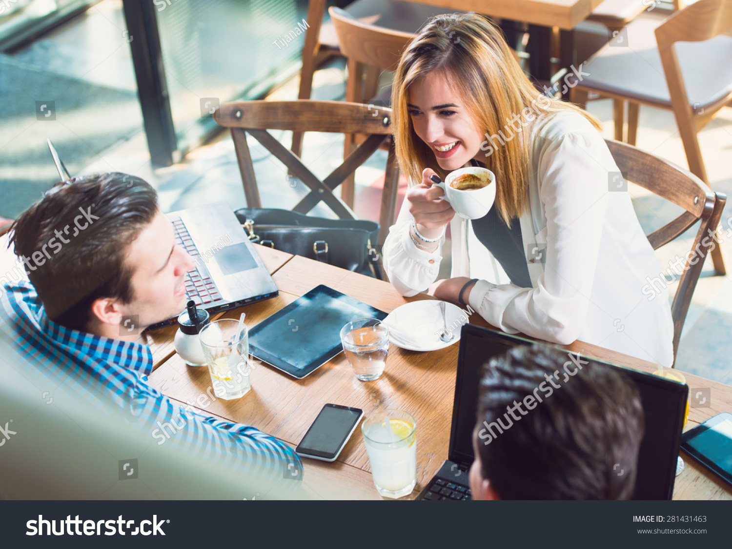 Young People Talking Over Coffee Table Stock Photo 281431463 - Shutterstock