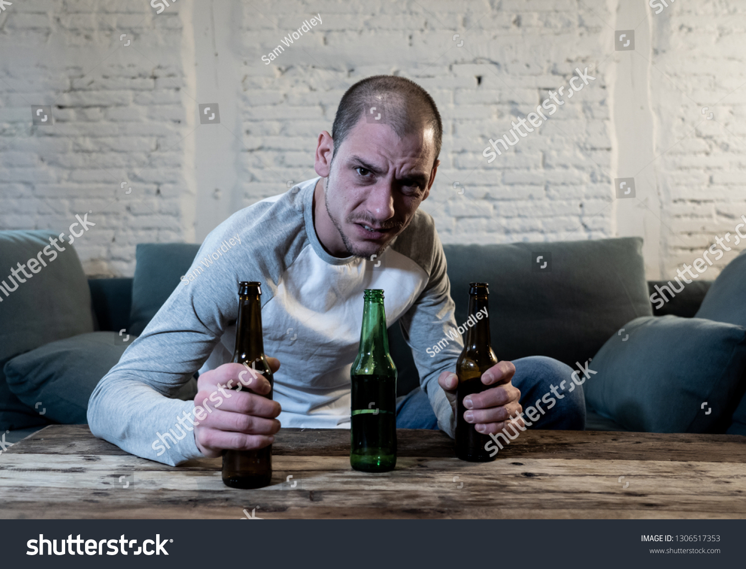 Young Sad Drunk Men Drinking Beer Stock Photo (Edit Now) 1306517353