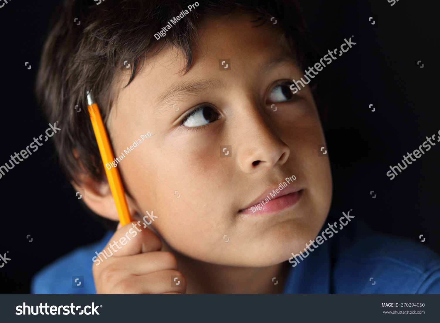 young schoolboy pencil chiaroscuro lighting shallow stock photo