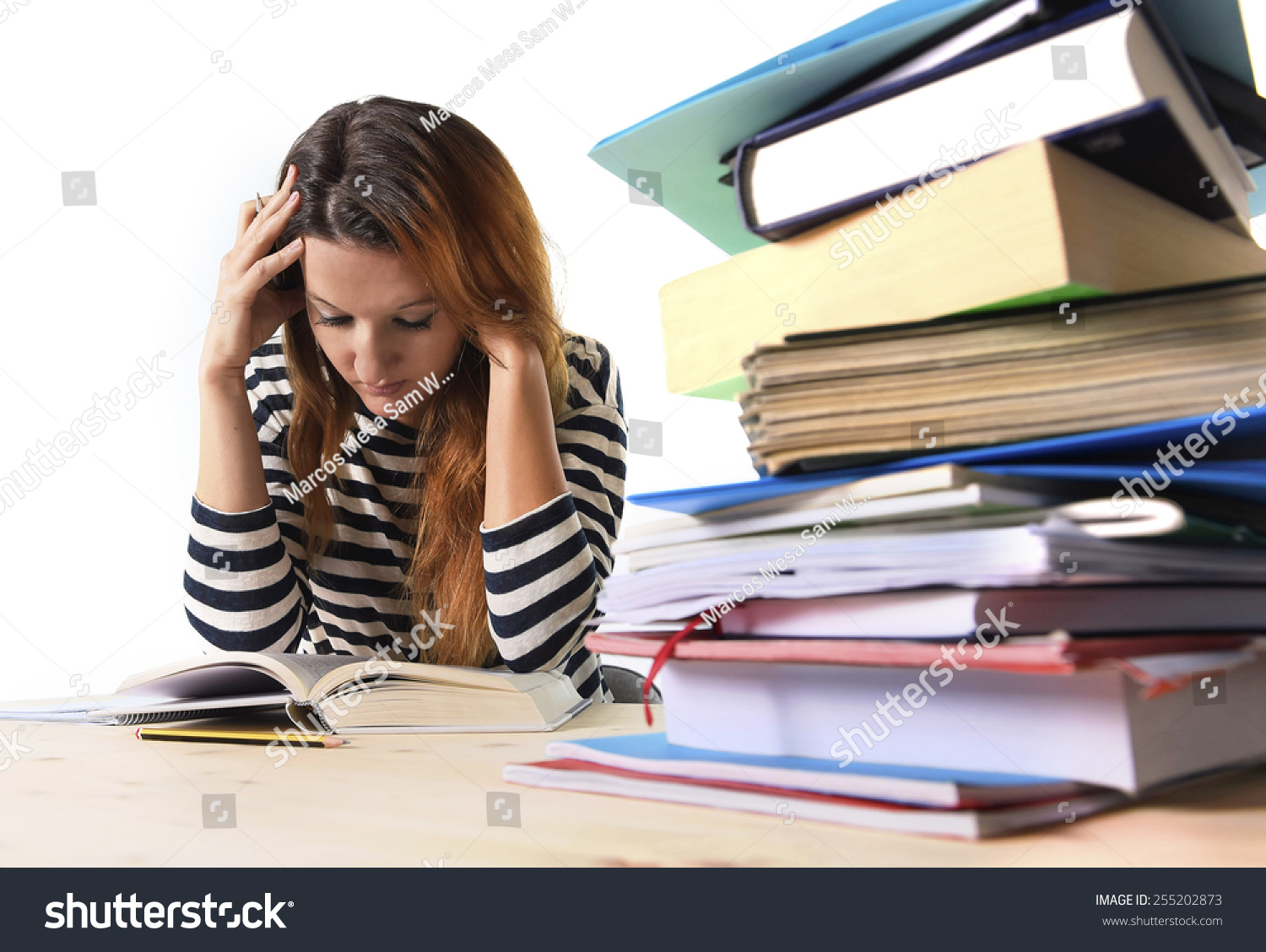 Young Stressed Student Girl Studying Pile Of Books On Library Desk ...