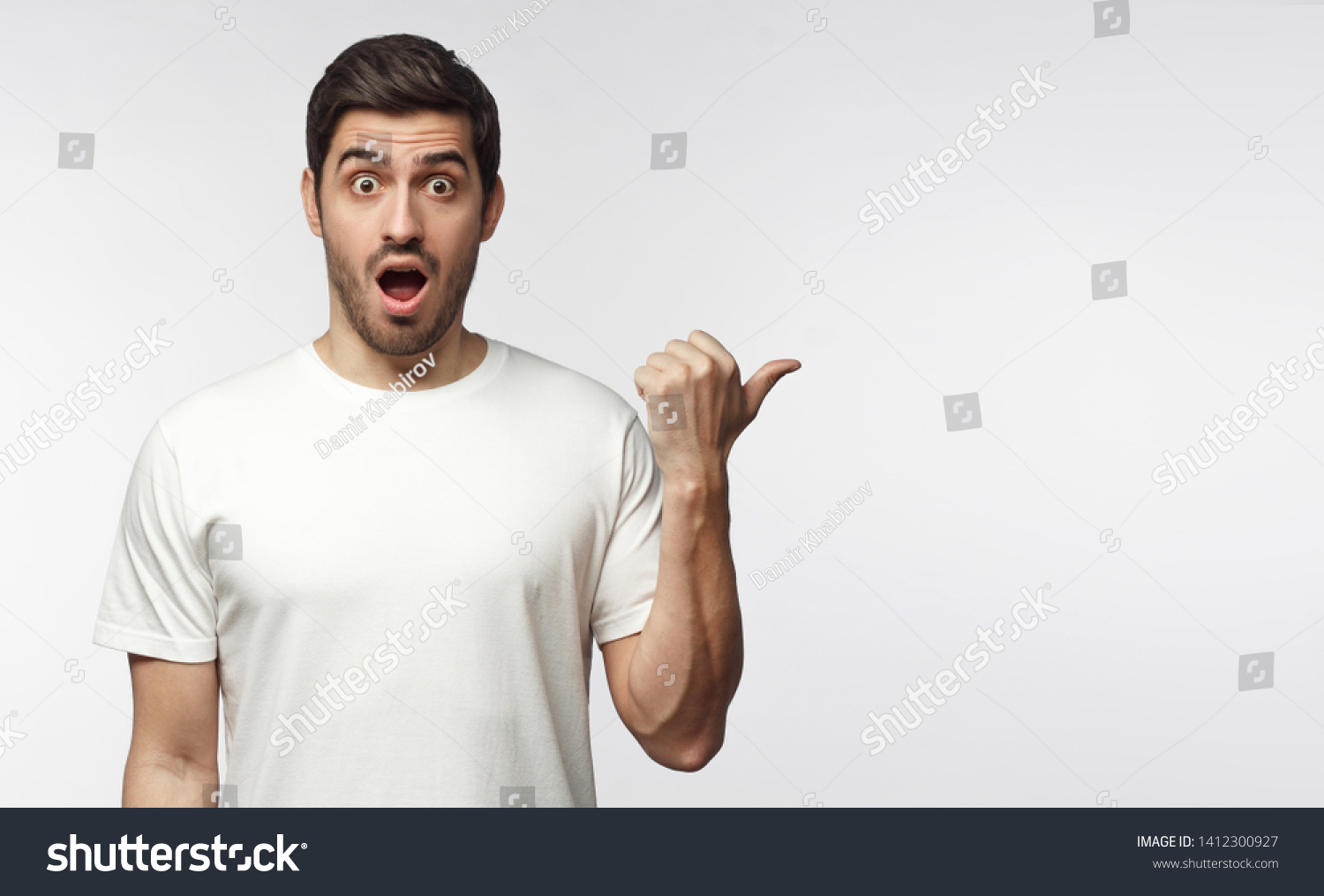 Young Surprised Man White Tshirt Looking Stock Photo 1412300927 ...