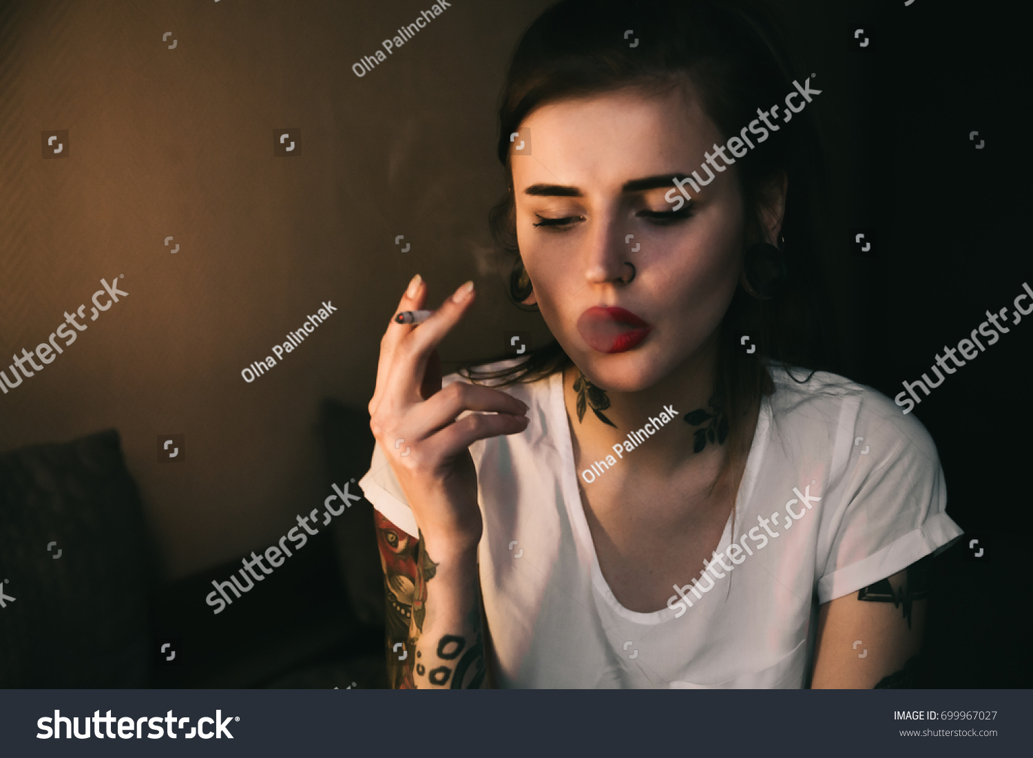 Young Tattooed Woman Smoking Room Warm Stock Photo (Edit Now) 699967027