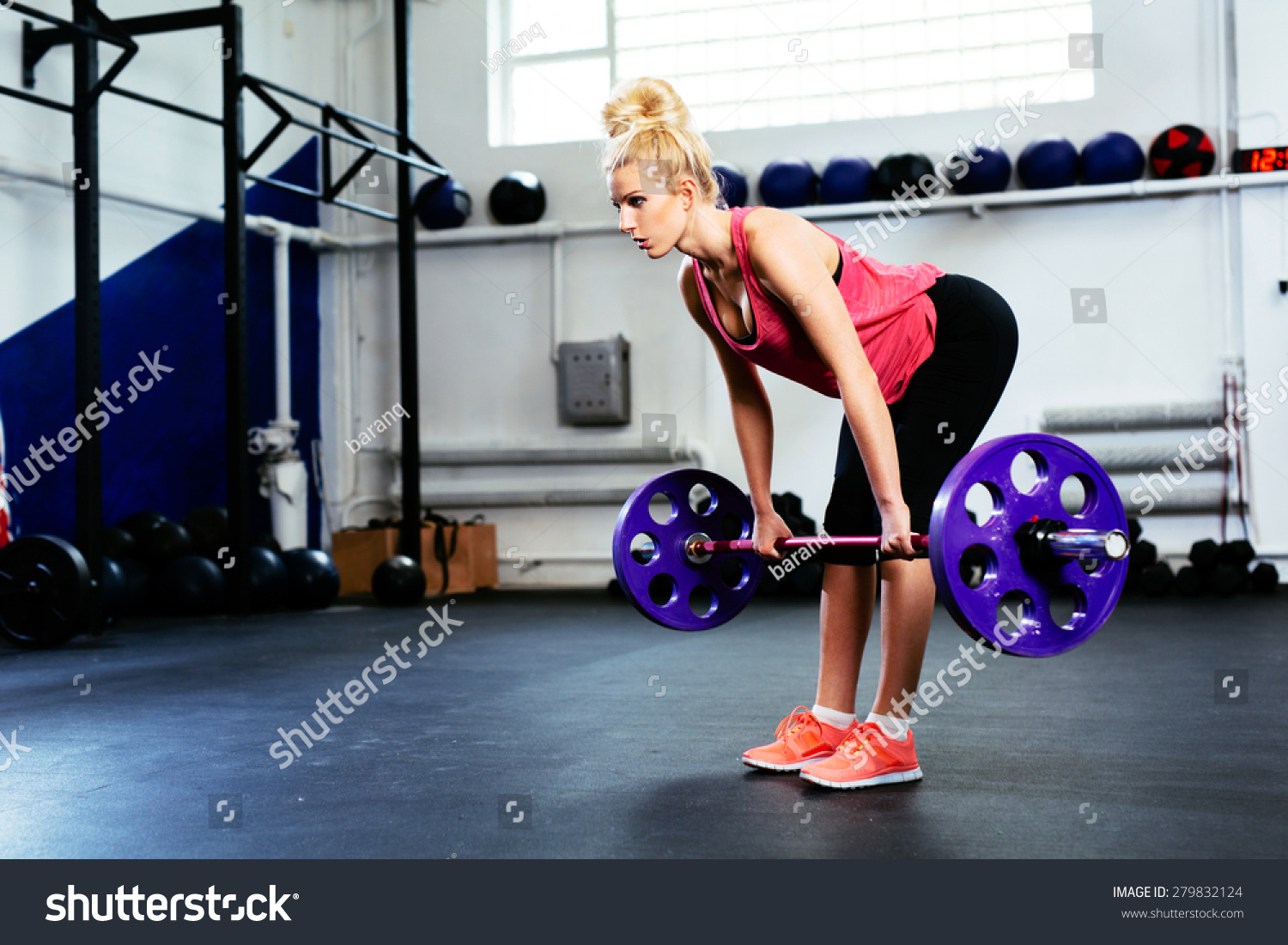 Young Woman Doing Straight Leg Deadlift Stock Photo Edit Now