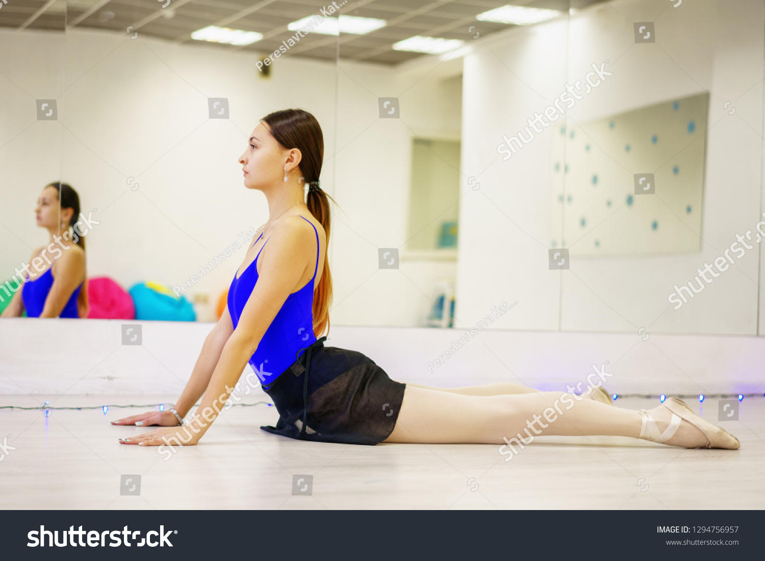 Young Woman Doing Warmup On Mat Stock Photo Edit Now 1294756957