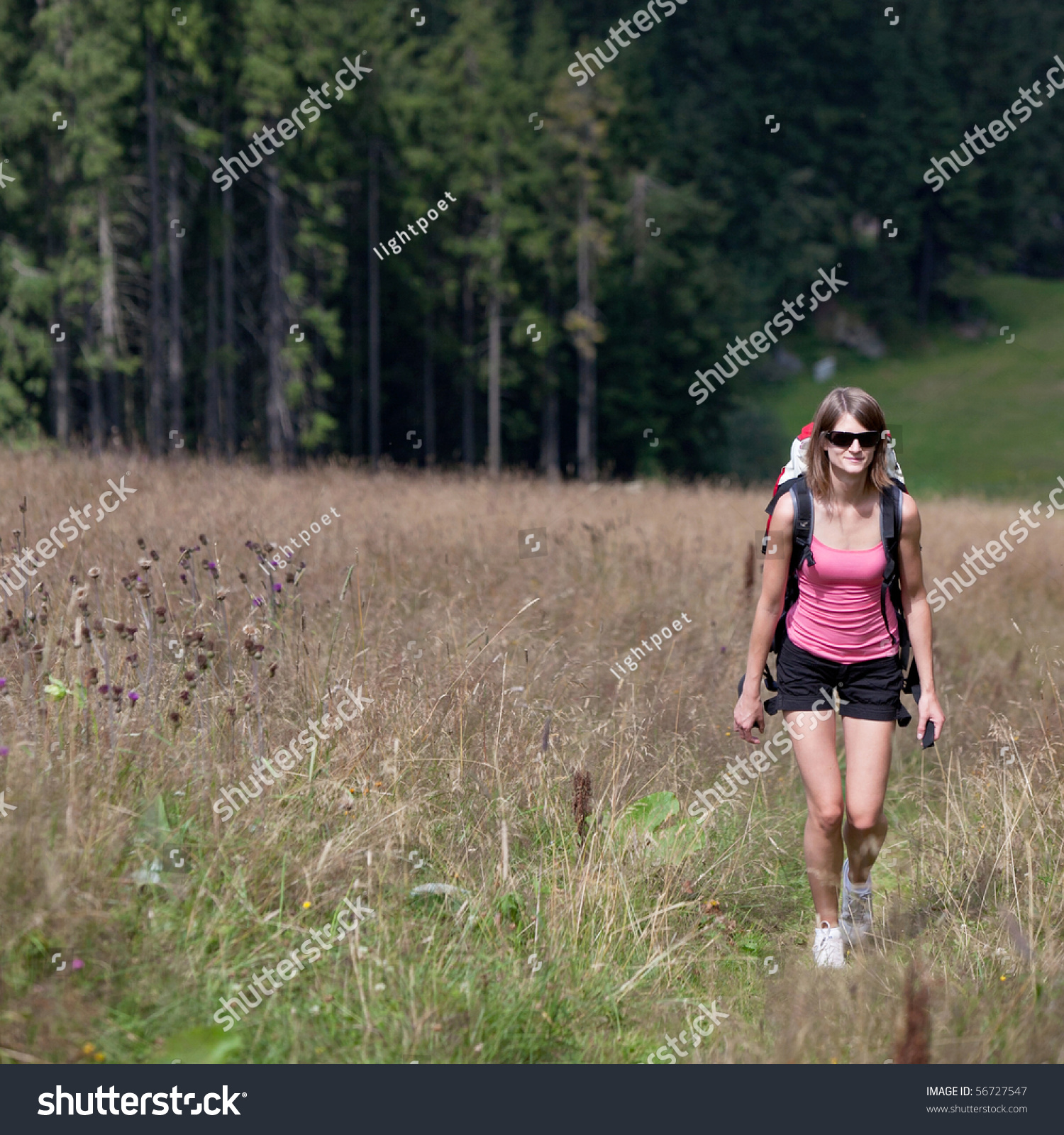 Young Woman Hiking Outdoors (Going Uphill) Stock Photo 56727547 ...