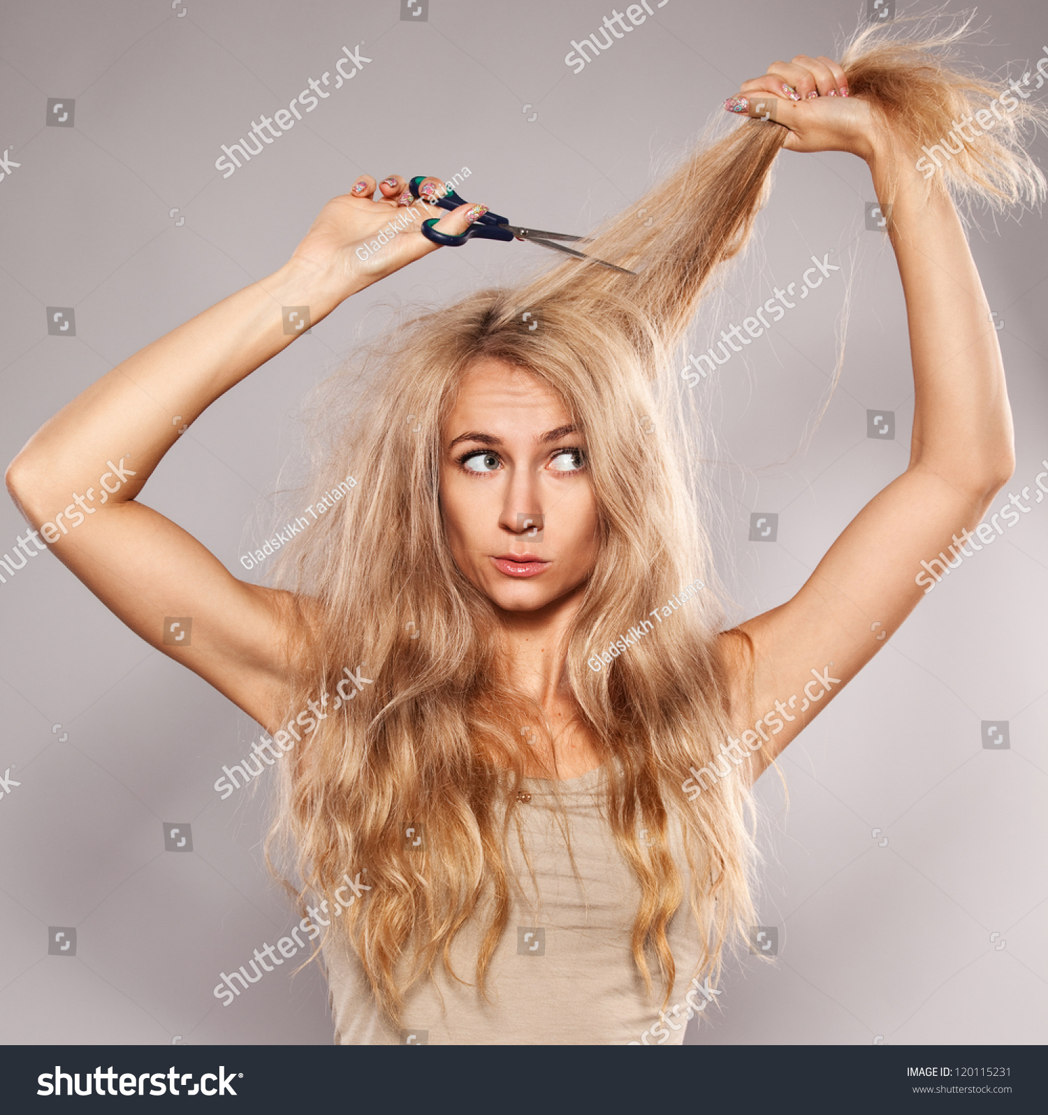 Young Woman Looking At Split Ends. Damaged Long Hair Stock Photo ...