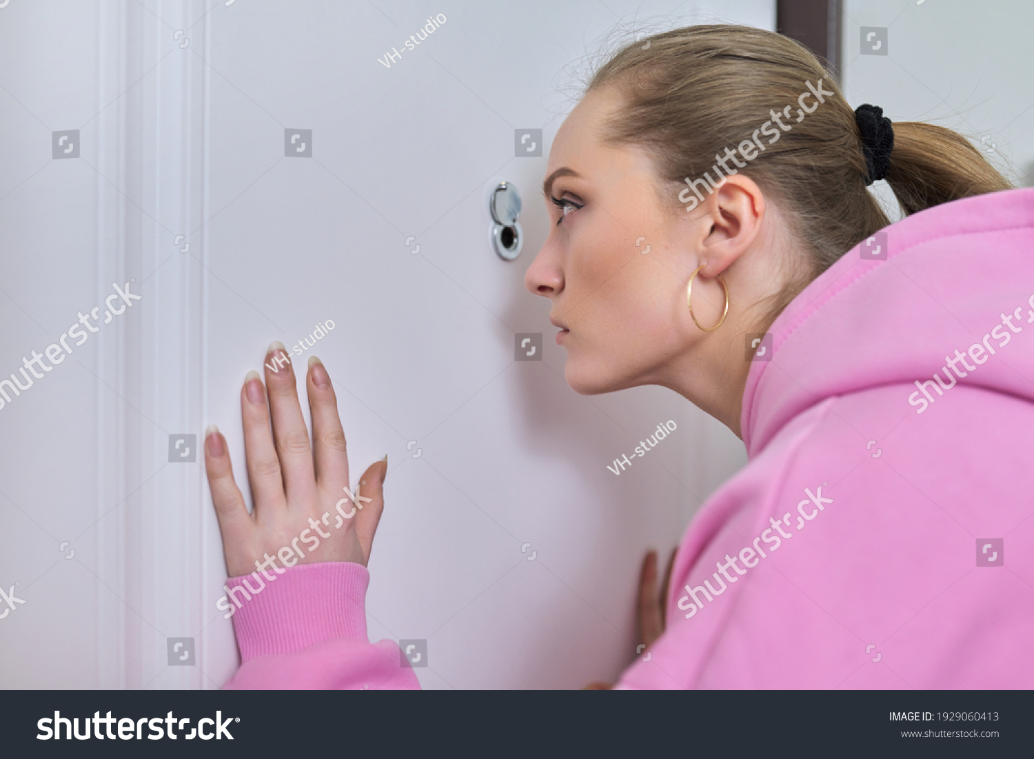 Young Woman Looking Through Peephole Front Stock Photo (Edit Now ...