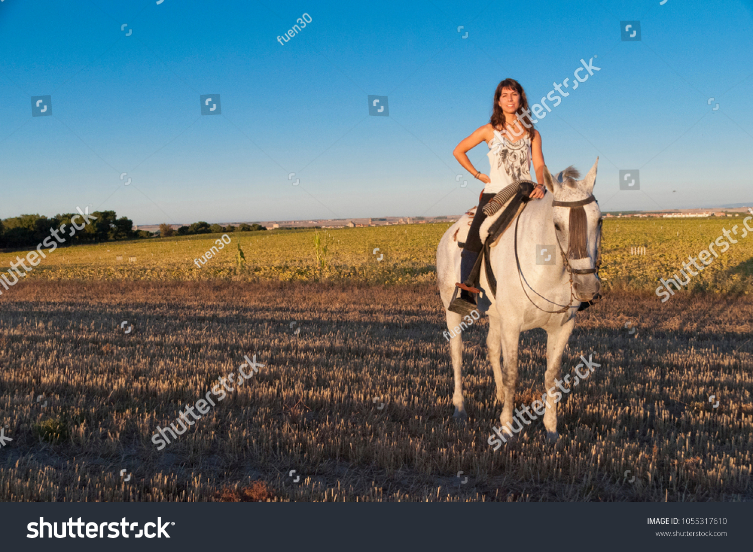 Young Woman Mounting Astride Stock Photo 1055317610 