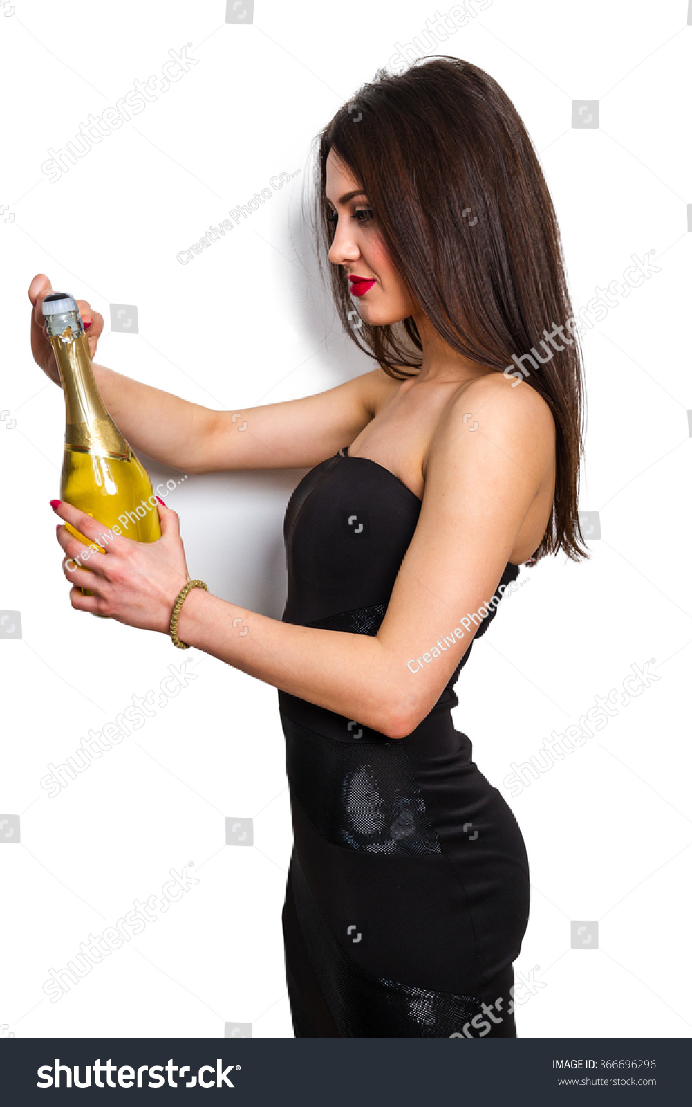 Young Woman Posing With Champagne Glass. Isolated Studio Portrait ...