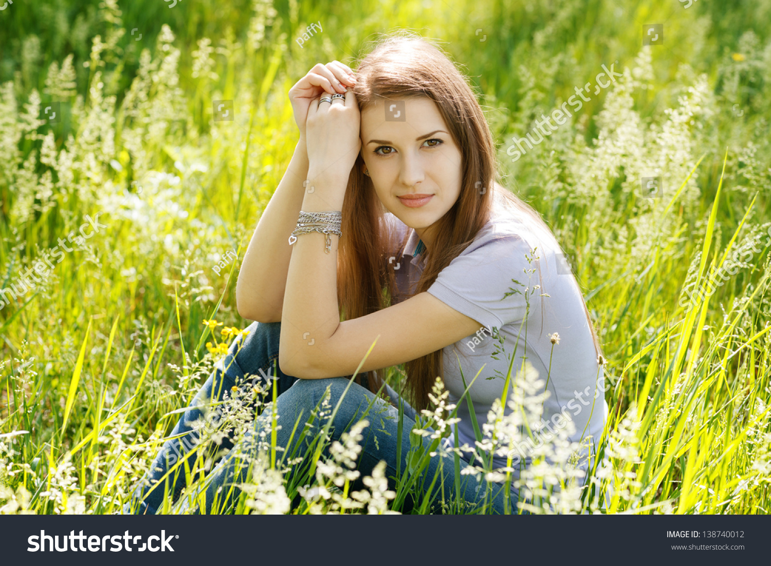 Young Woman Sitting In Green Grass Outdoors Stock Photo 138740012 ...