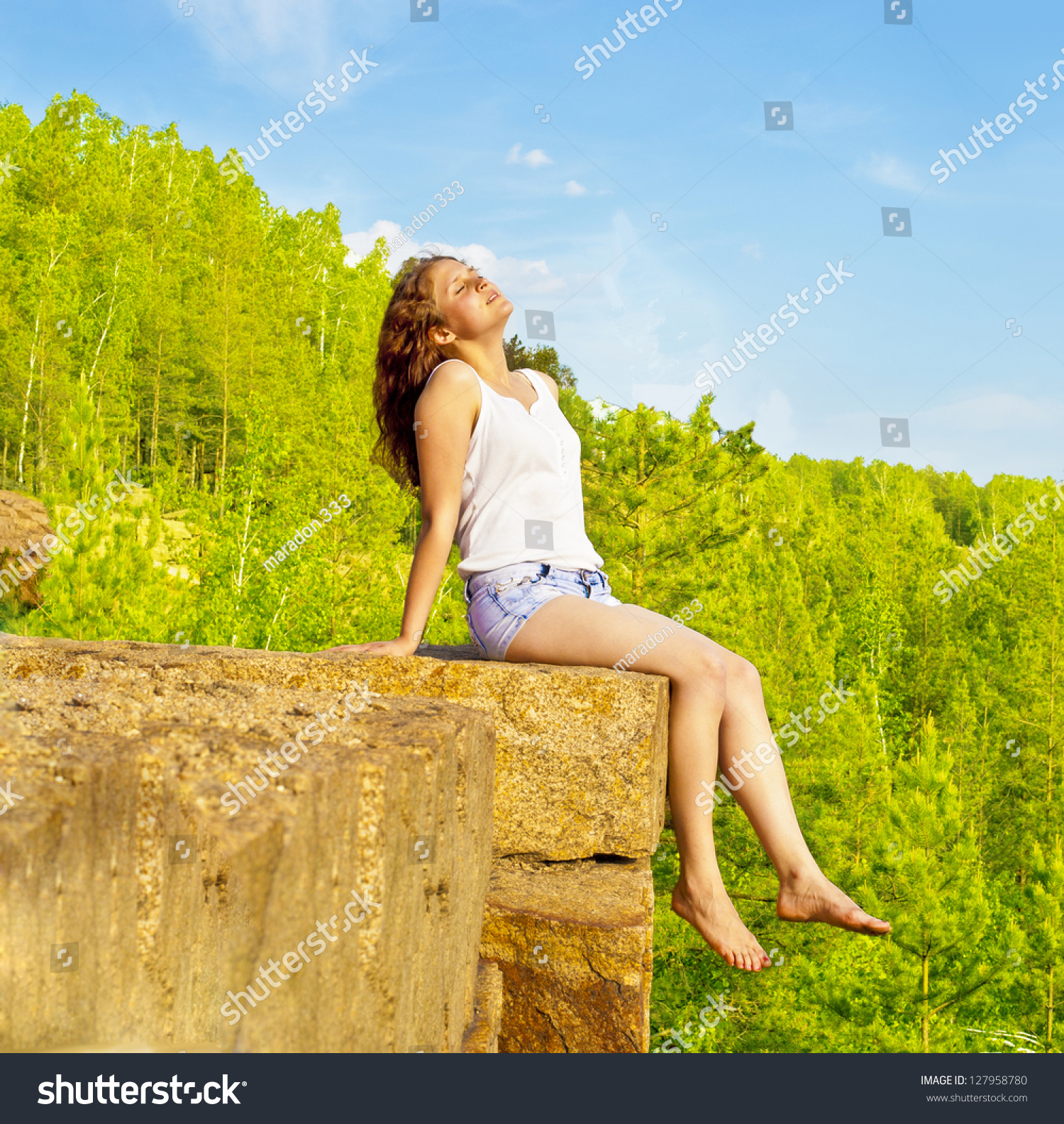 Young Woman Sitting On Cliff'S Edge And Sleeping On Mountain Slender ...