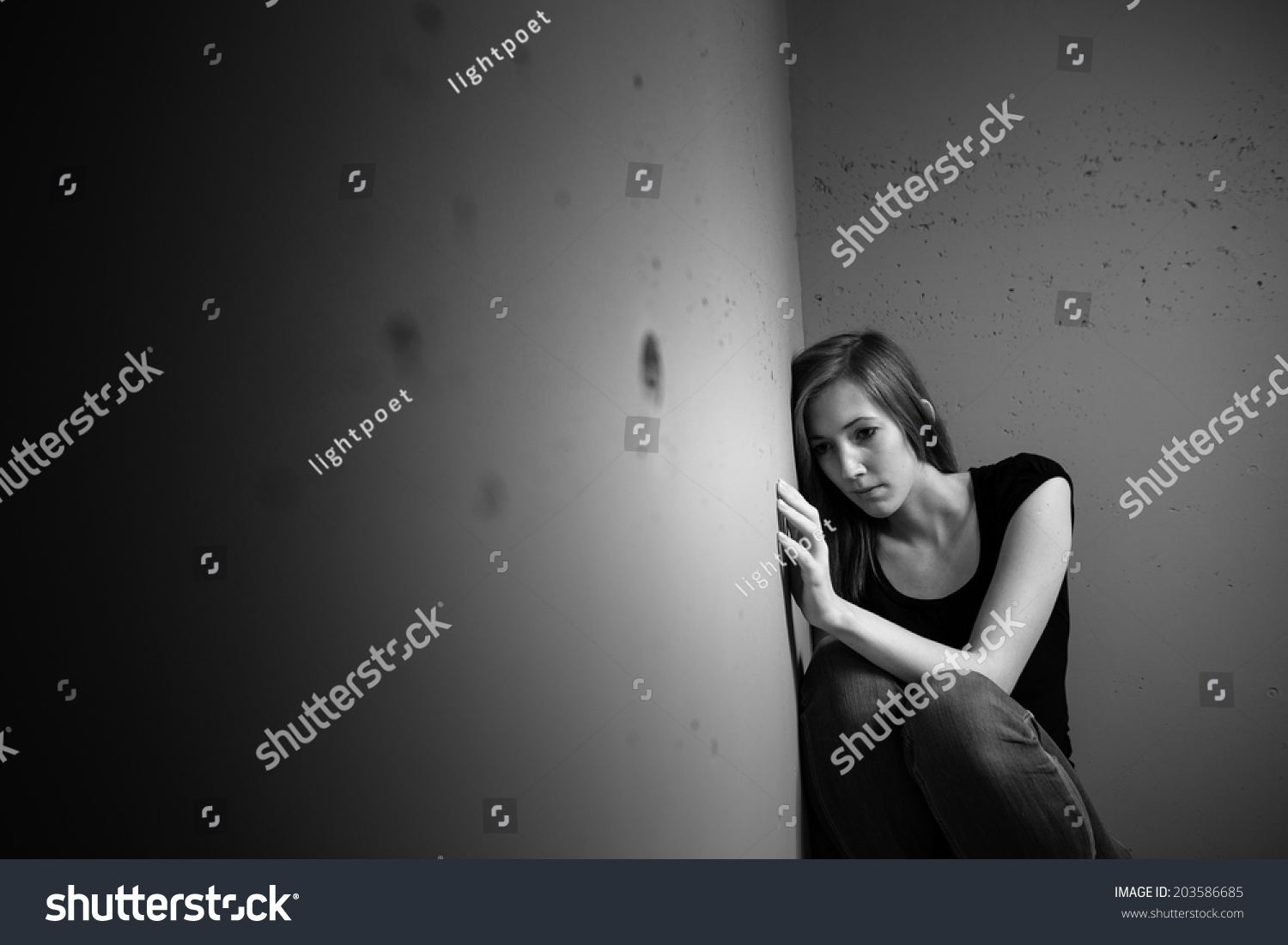 Young Woman Suffering From A Severe Depression (Very Harsh Lighting Is ...